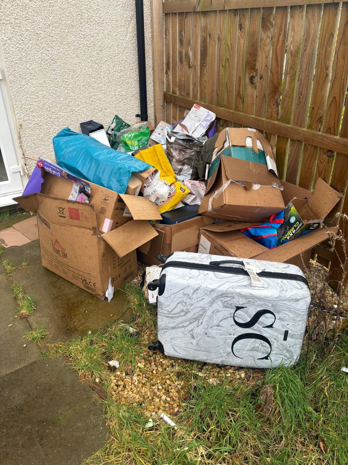 Broken IKEA furniture and cardboard before uplift